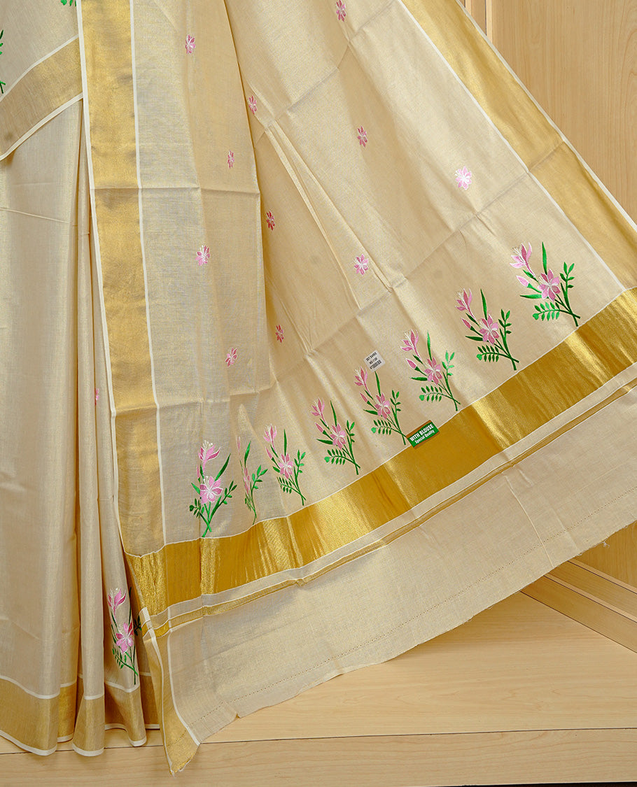 Cream colour Tissue kerala saree featuring Embroidery buttas on body, complemented by Floral plant thread work & kasavu kara, comes with matching blouse piece.