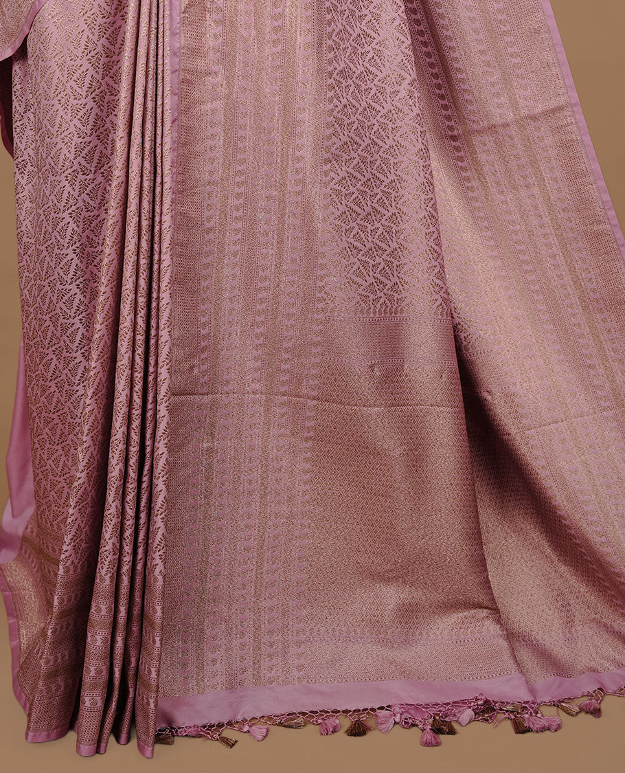 Pink colour Semi Banaras Katan saree featuring Antique zari Floral pattern on body, complemented by self colour zari border, paired with matching blouse piece.