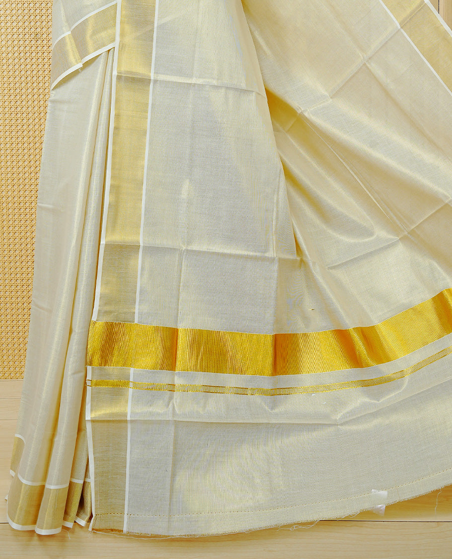Cream Colour Tissue Kerala Saree Featuring Plain Body, Enhanced With A Gold Zari Border, A Traditional Gold Zari Pallu, And A Matching Blouse Piece.