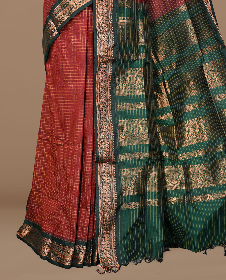 Maroon colour kalyani cotton saree featuring gold zari check pattern on body, complemented by green colour with Antique zari border, paired with matching blouse piece.