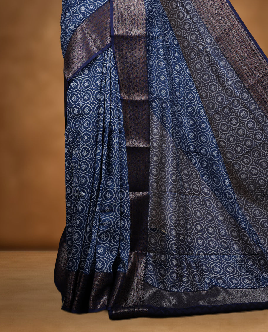 Dark blue colour chanderi silk saree with Floral block print On body, compilmented by self colour border with antique zari pattern and a matching blouse.