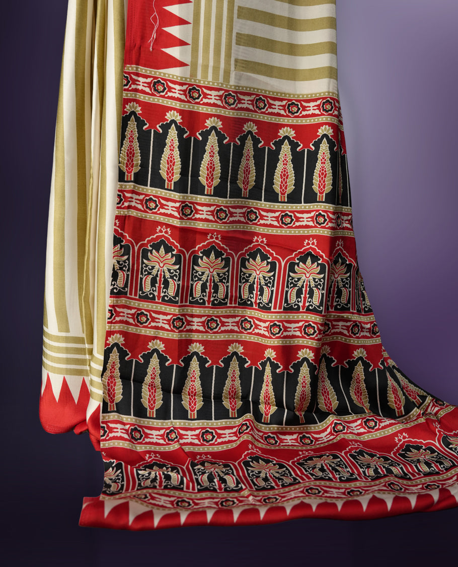 Beige colour saree with olive green stripes, highlighted by a striking red geometric border and a beautifully patterned pallu with intricate motifs, comes with a matching blouse.