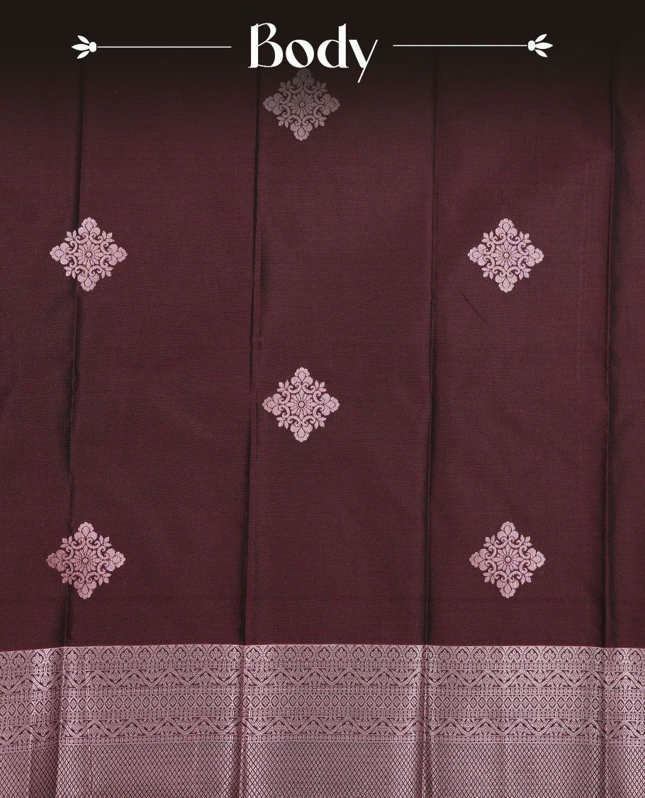 Chocolate brown colour soft silk saree featuring rose Gold zari motifs on body, complemented by self colour with traditional border, paired with matching blouse piece.