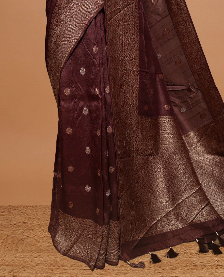 Chocolate brown colour Semi banaras tussar georgette Saree featuring Antique zari motifs on body, enhanced with antique zari border, paired with a matching blouse piece.
