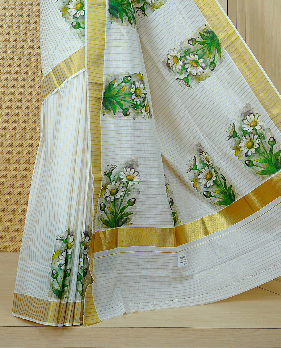 Cream Colour Kerala Saree Featuring A Light Gold Zari Pattern And Floral Prints On The Body, Enriched By A Traditional Zari Border And Pallu, Paired With A Matching Blouse Piece