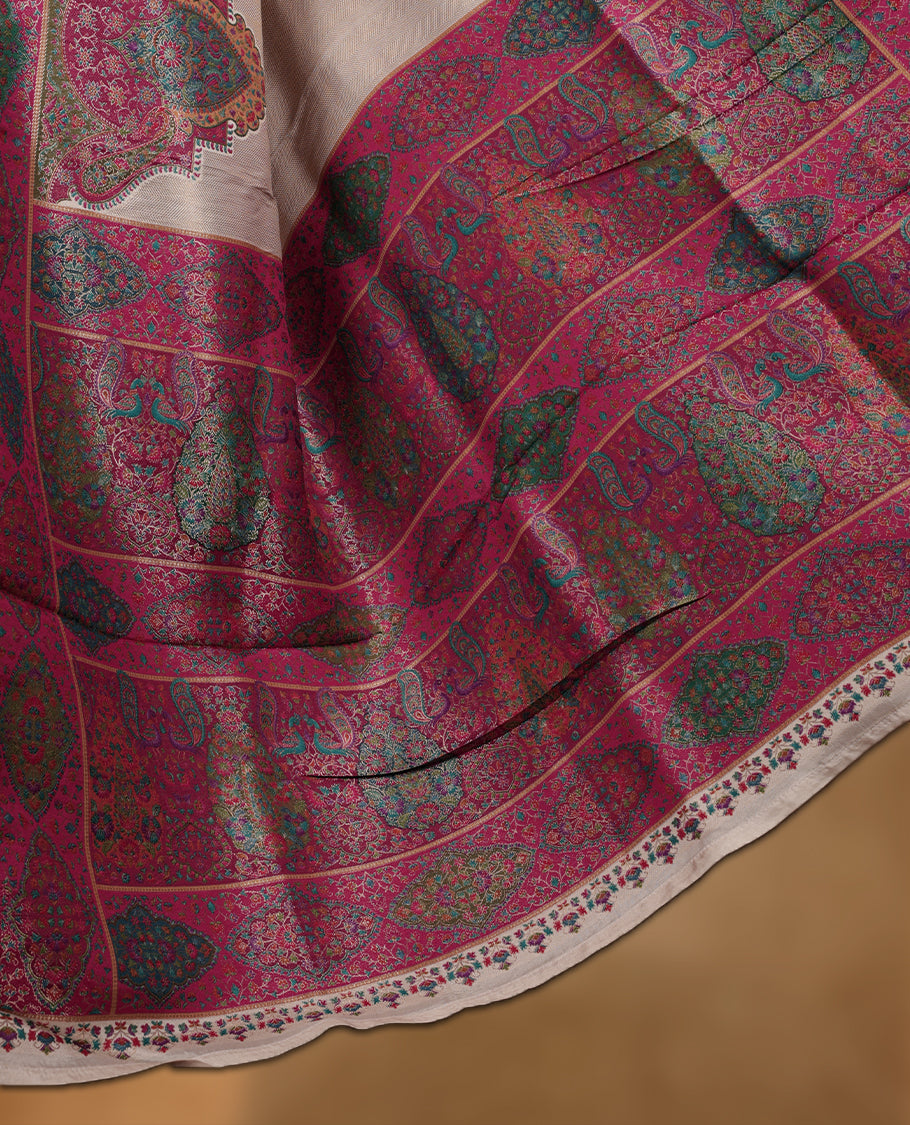 Beige colour Pashmina silk saree intricately woven with Mughal inspired garden scenes and figurative motifs across the body, framed by a rich maroon storytelling border and grand pallu, paired with a coordinated maroon woven jaal blouse piece (Copy)