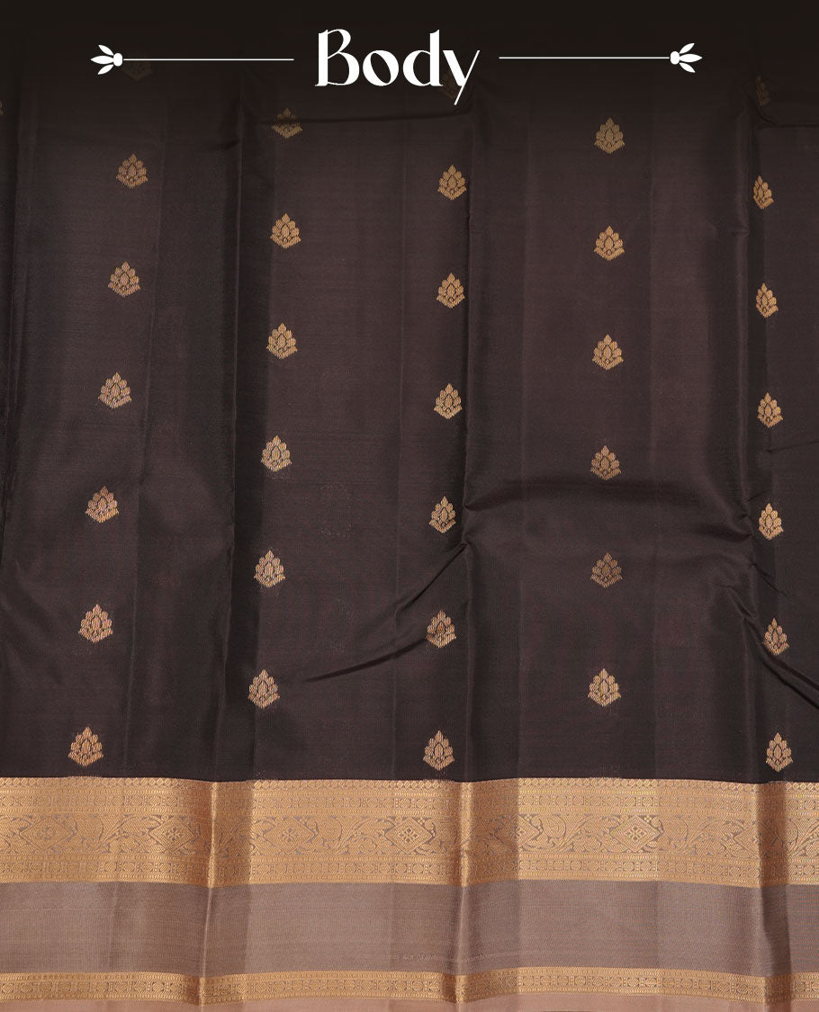 Black colour vasundhara silk saree featuring gold zari buttas on body, complemented by contrast chikku with zari border, paired with matching blouse piece.