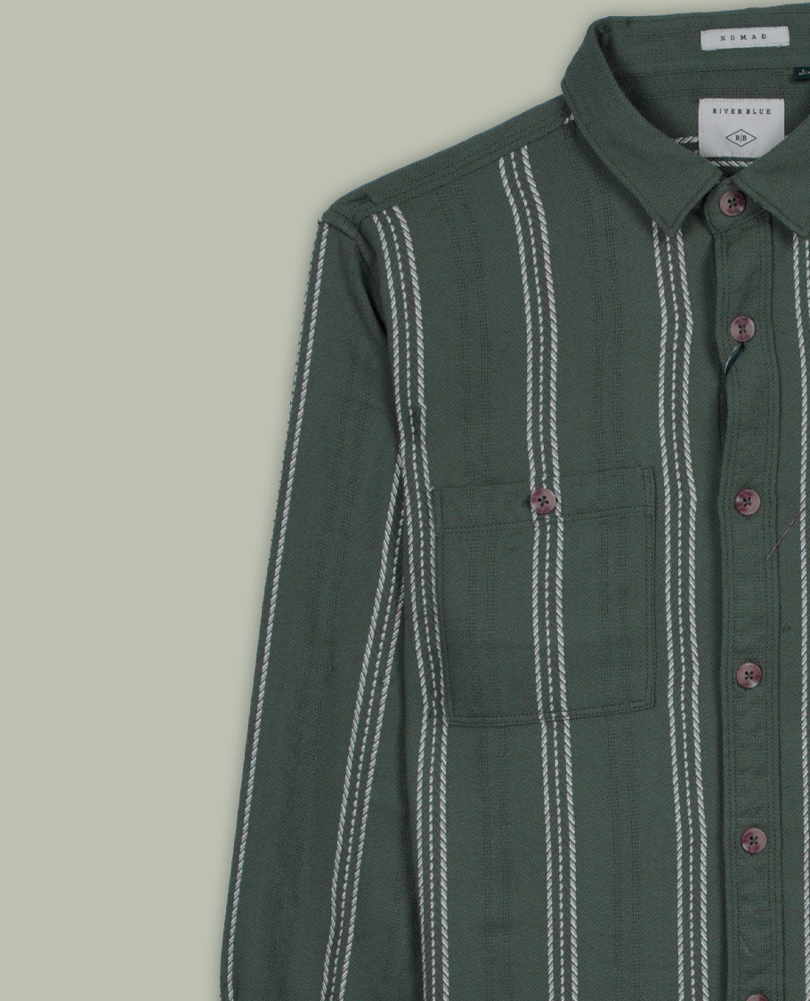 Deep green colour shirt with white vertical stripes, crafted in soft cotton for all day comfort, Featuring full sleeves, dual chest pockets, and a classic collar, it delivers a bold yet timeless casual style.