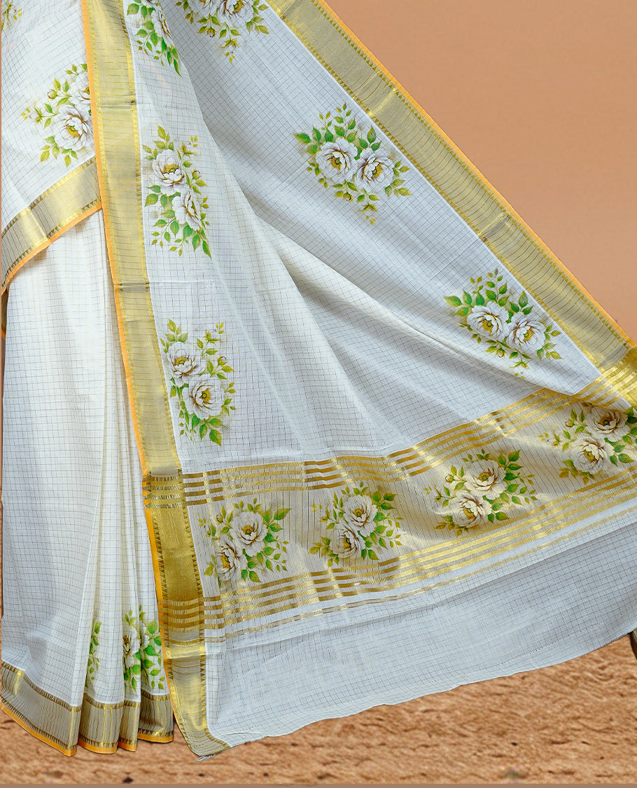 Cream Colour Kerala Saree Featuring Golden Checks On The Body, Complemented By A Traditional Gold Zari & Floral Printed Border, Paired With A Matching Blouse Piece.