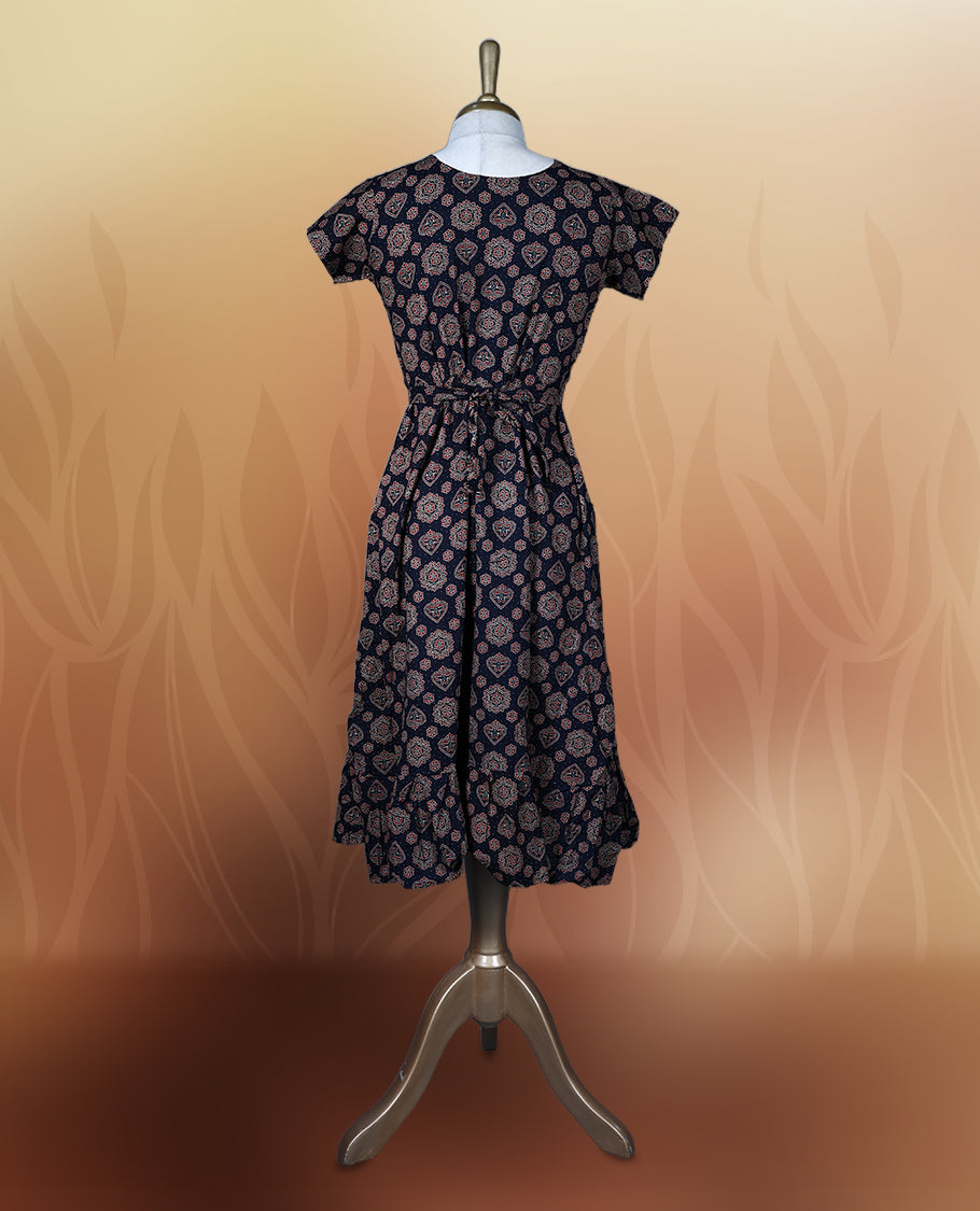 Black colour nightwear adorned with soft maroon floral prints, featuring a V neckline, short sleeves, and a flared ruffle hem, A stylish and comfortable choice for daily wear, brunches, or casual outings.