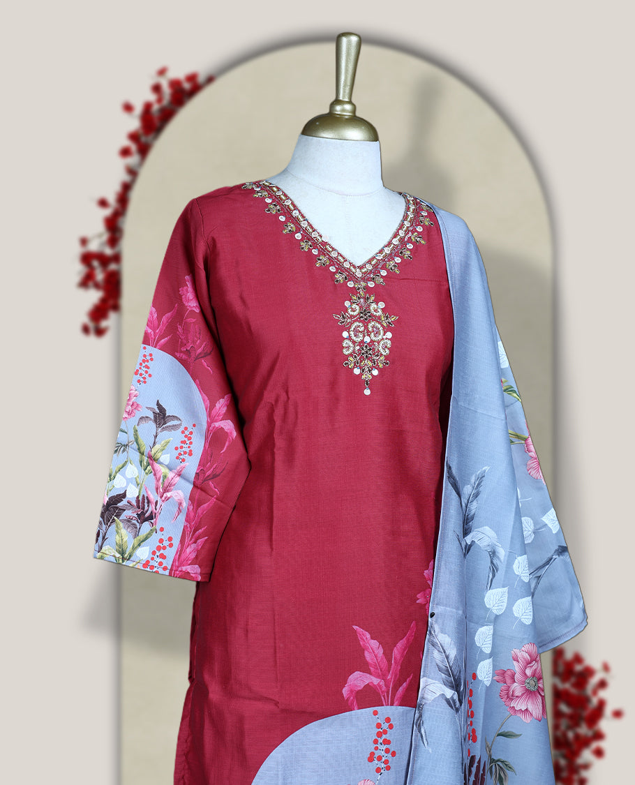 Light maroon colour churidhar set with sequin and bead embroidered neckline, paired with a light grey floral printed dupatta and matching bottom & A graceful choice for festive gatherings and casual outings.
