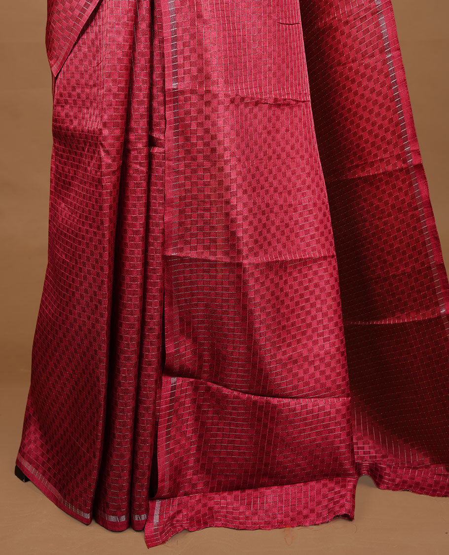 Rose Red colour Semi Tussar saree featuring an elegant zari fancy check pattern on the body, highlighted with a small border for a refined look. Comes without a blouse piece.