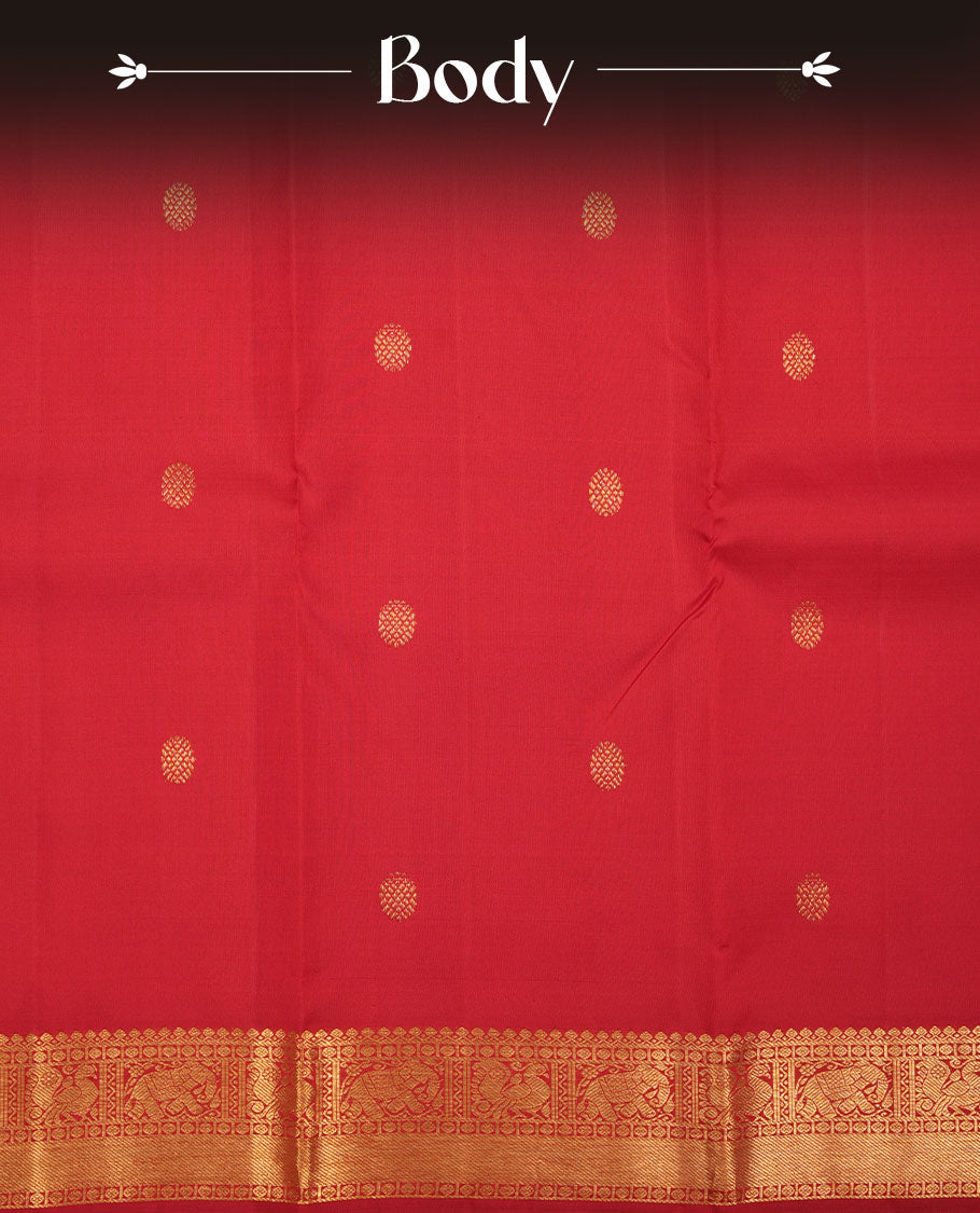 Red colour pure traditional Kancheepuram silk saree adorned with an elegant zari motif on the body