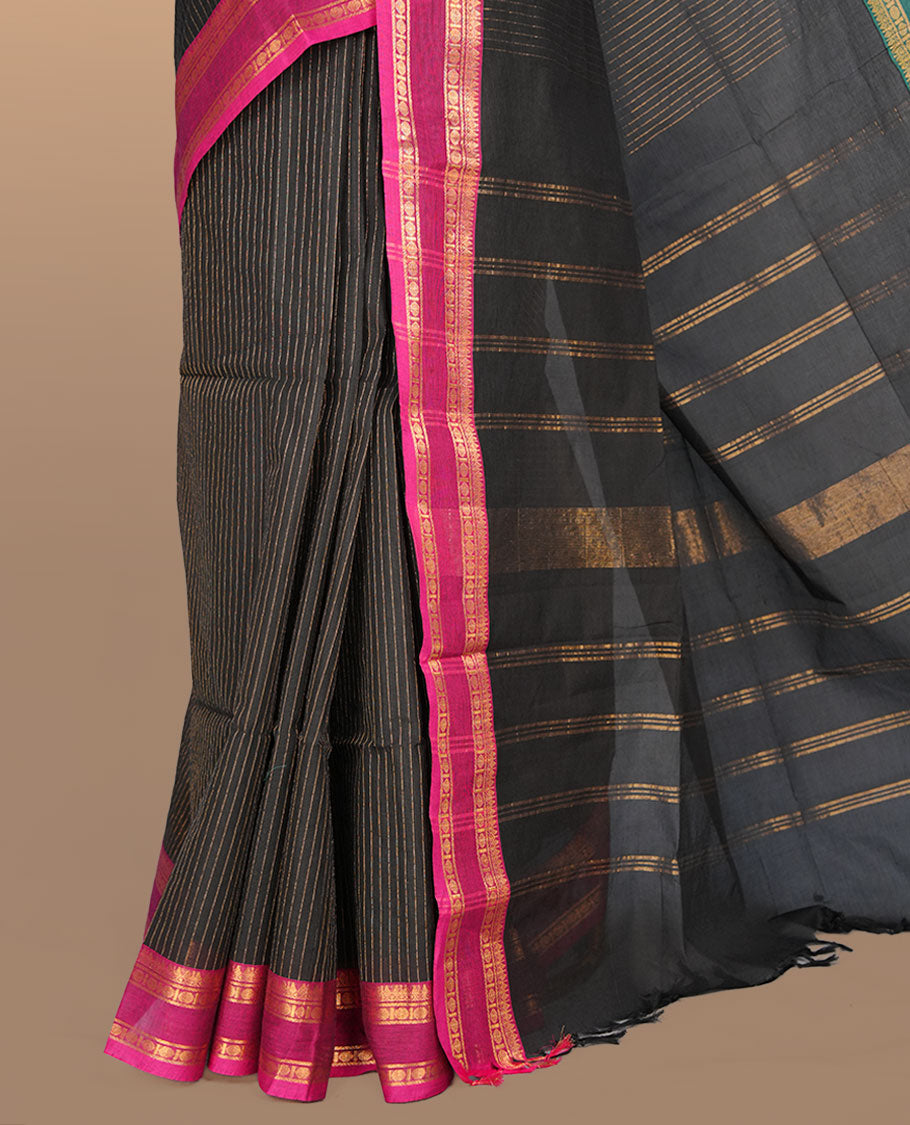 Black colour chettinad cotton featuring gold zari check pattern on body , complemented by contrast teal & magenta double colour with gold zari border, paired with matching blouse piece.