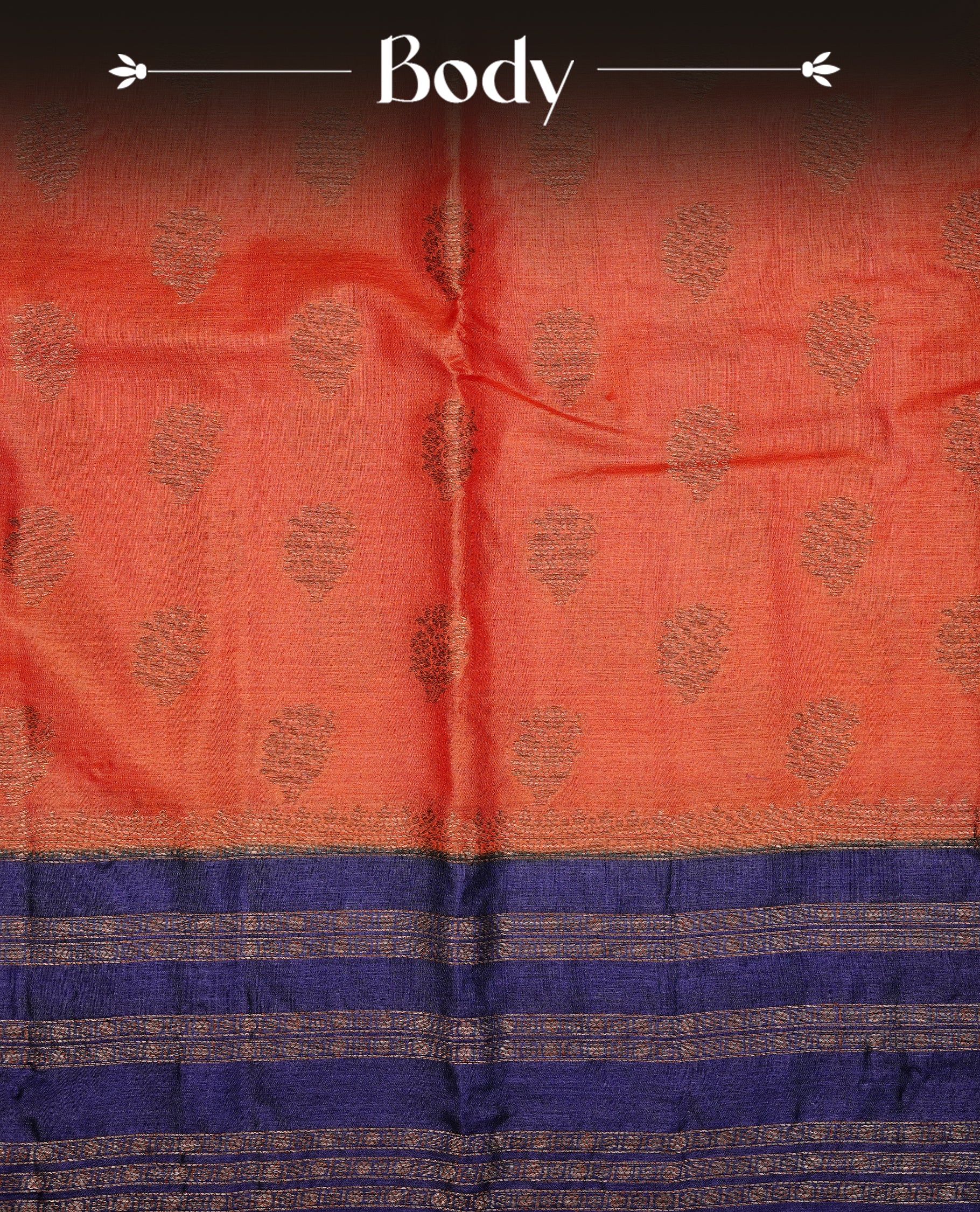 Rust orange colour pure tussar Banaras silk saree featuring elegant gold zari motifs across the body, complemented by a contrast Navy blue border with rich zari detailing. Comes with a matching blouse piece