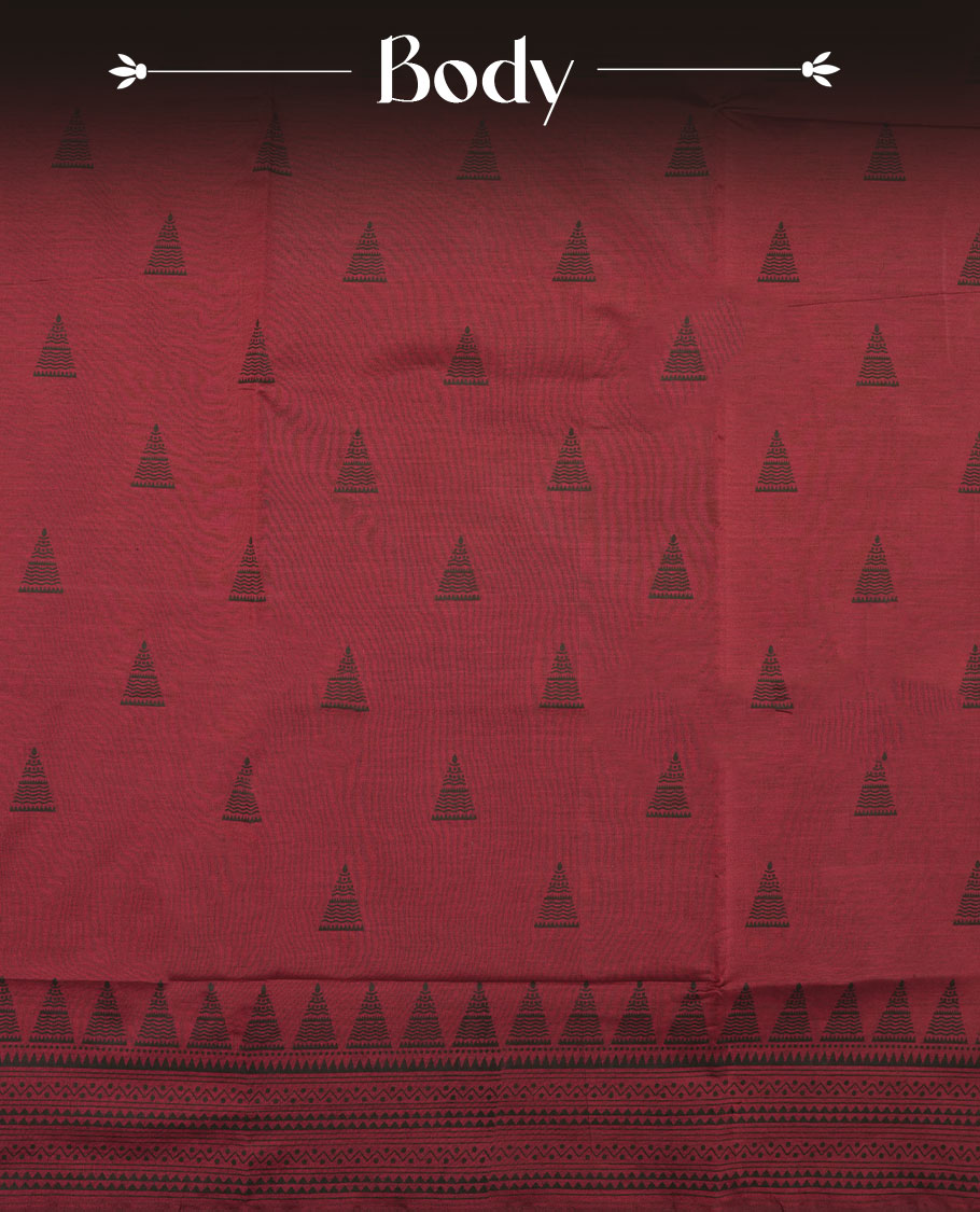 Dark red colour poly cotton saree with black temple motifs on the body, paired with a matching with black woven traditional border, and a coordinated all‑over geometric printed blouse piece.