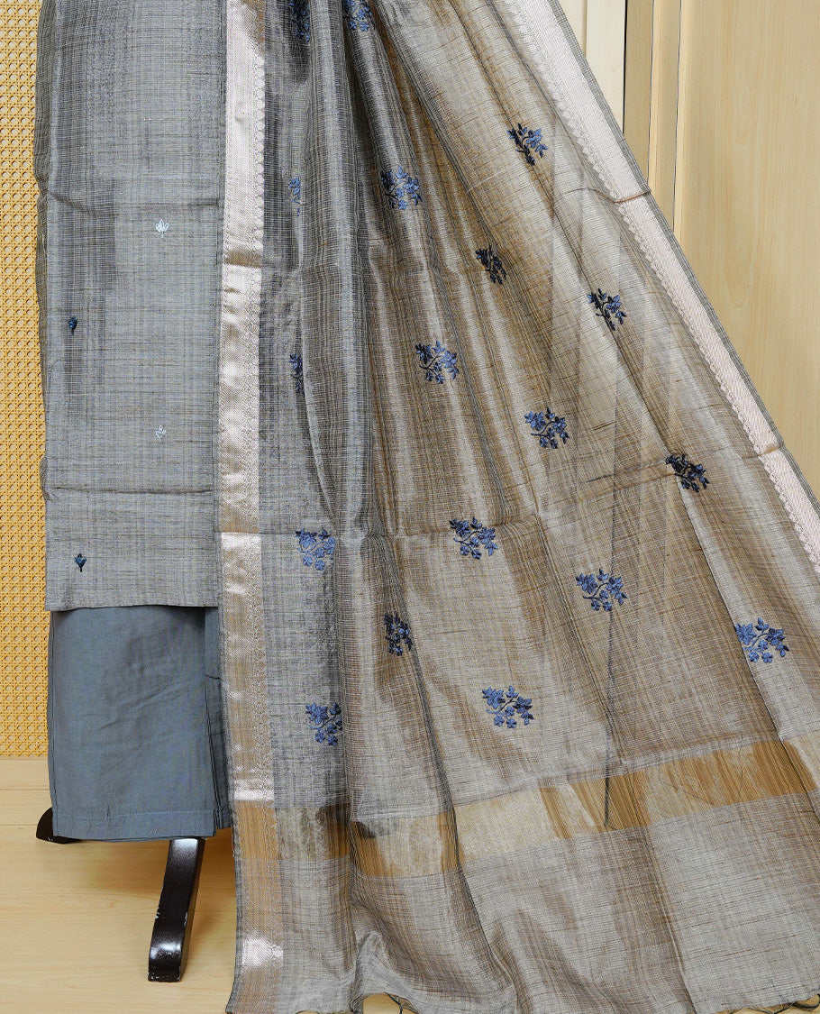 Blue colour Tissue Churidar Set featuring delicate floral embroidery and subtle bead detailing on the yoke, paired with matching solid pants and dupatta.