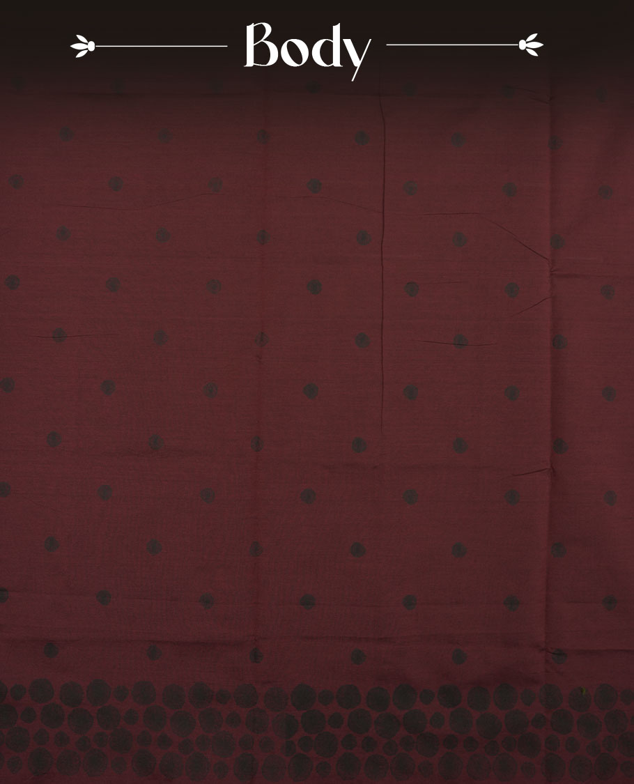 Dark maroon colour poly cotton saree with black abstract butti motifs on the body, paired with a matching pallu with dense black textured round butta pattern, and a coordinated all‑over textured round butta printed blouse piece.