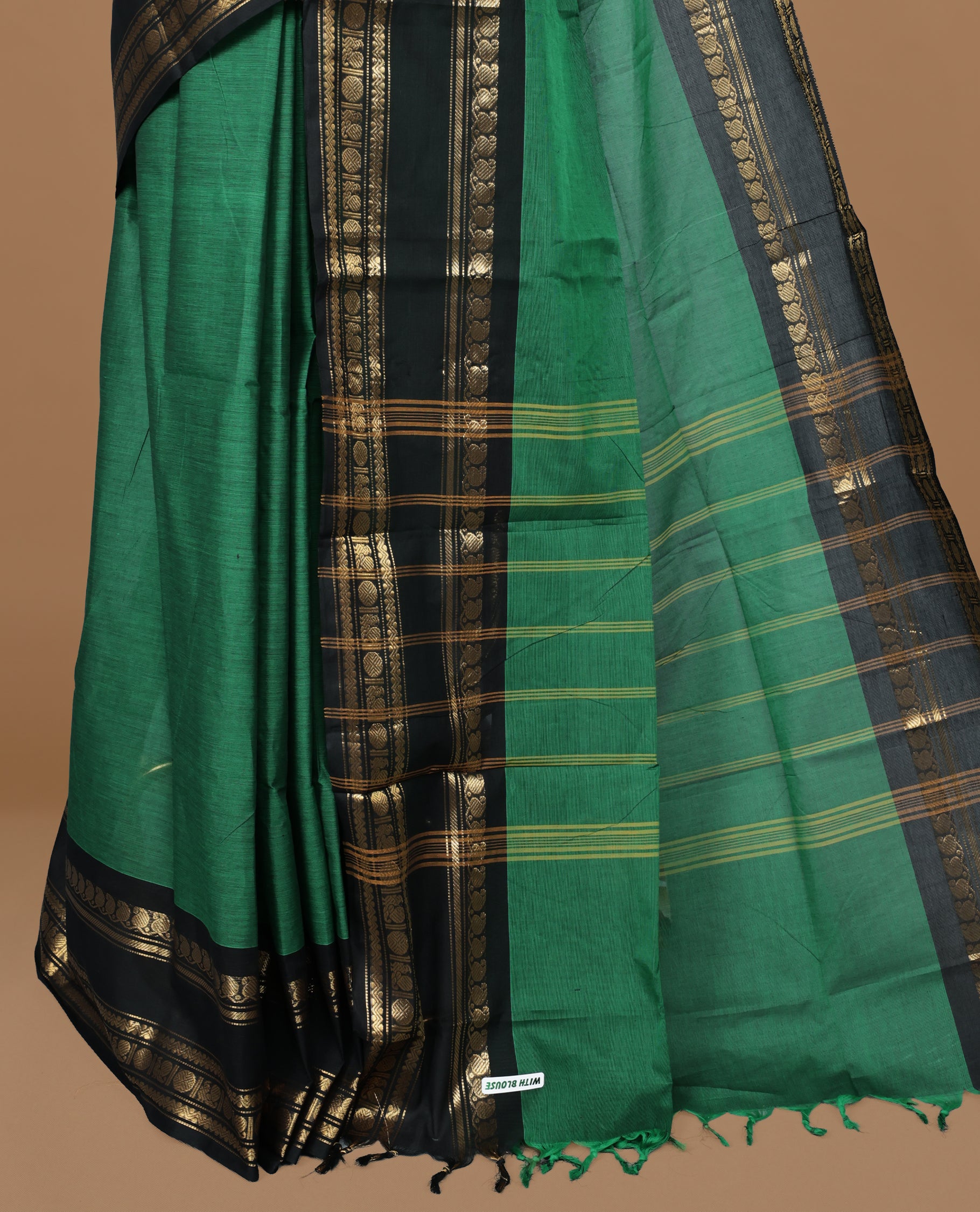Green colour Chettinad cotton saree featuring motifs on body , complemented by contrast Black colour with zari border, comes with matching blouse piece.
