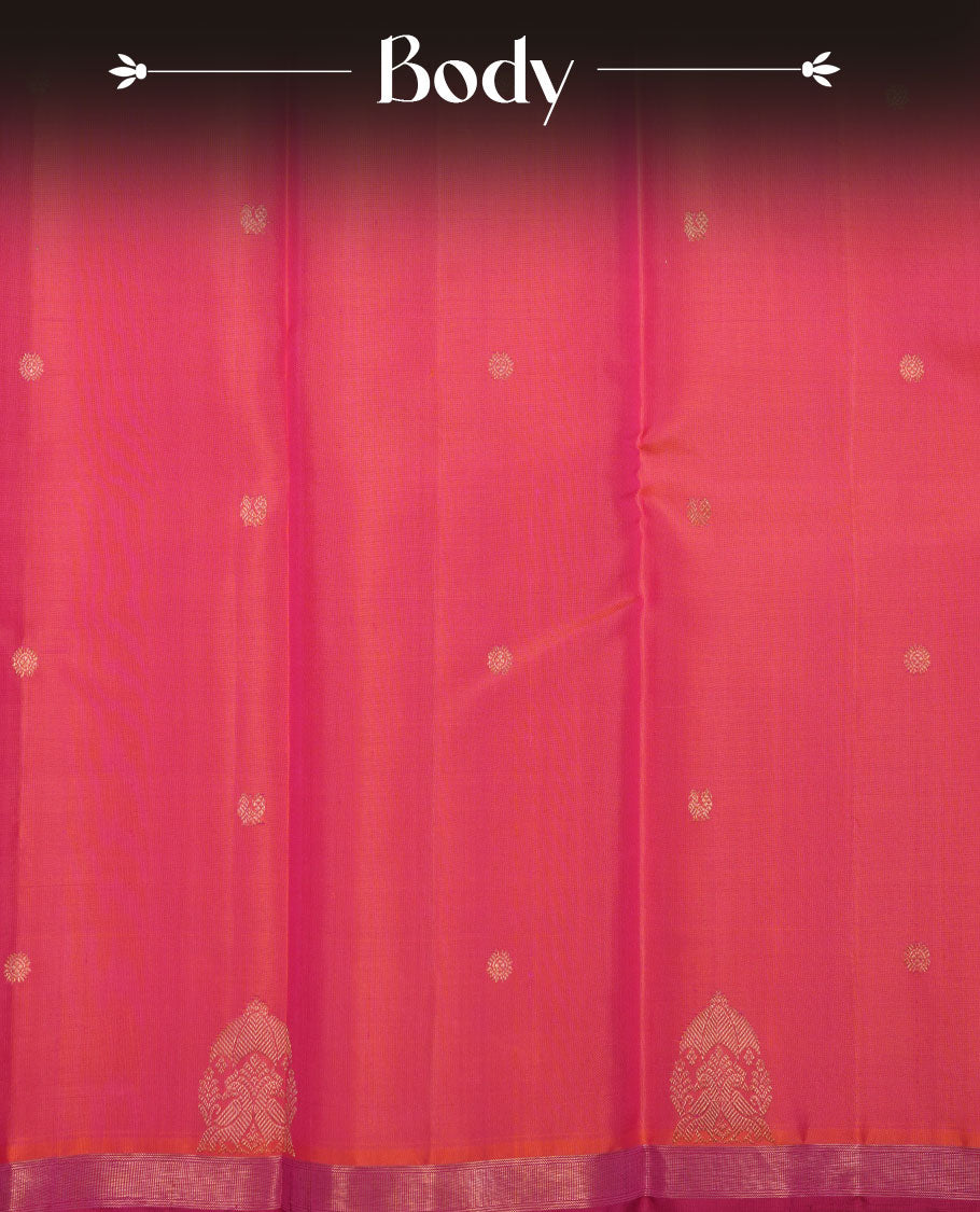 Orange and pink double shade pure traditional Kancheepuram silk saree adorned with elegant zari peacock and chakra motifs on the body, complemented by a simple contrast zari woven border, paired with a matching blouse piece.