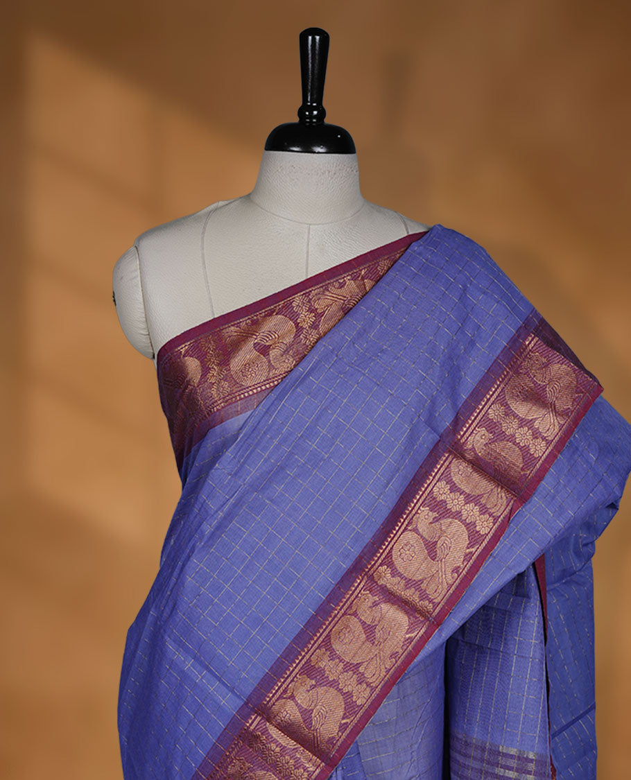 Lavender colour sungudi cotton saree featuring gold zari check pattern across body, contrast Maroon colour with gold zari peacock and floral pattern on border, without blouse piece.