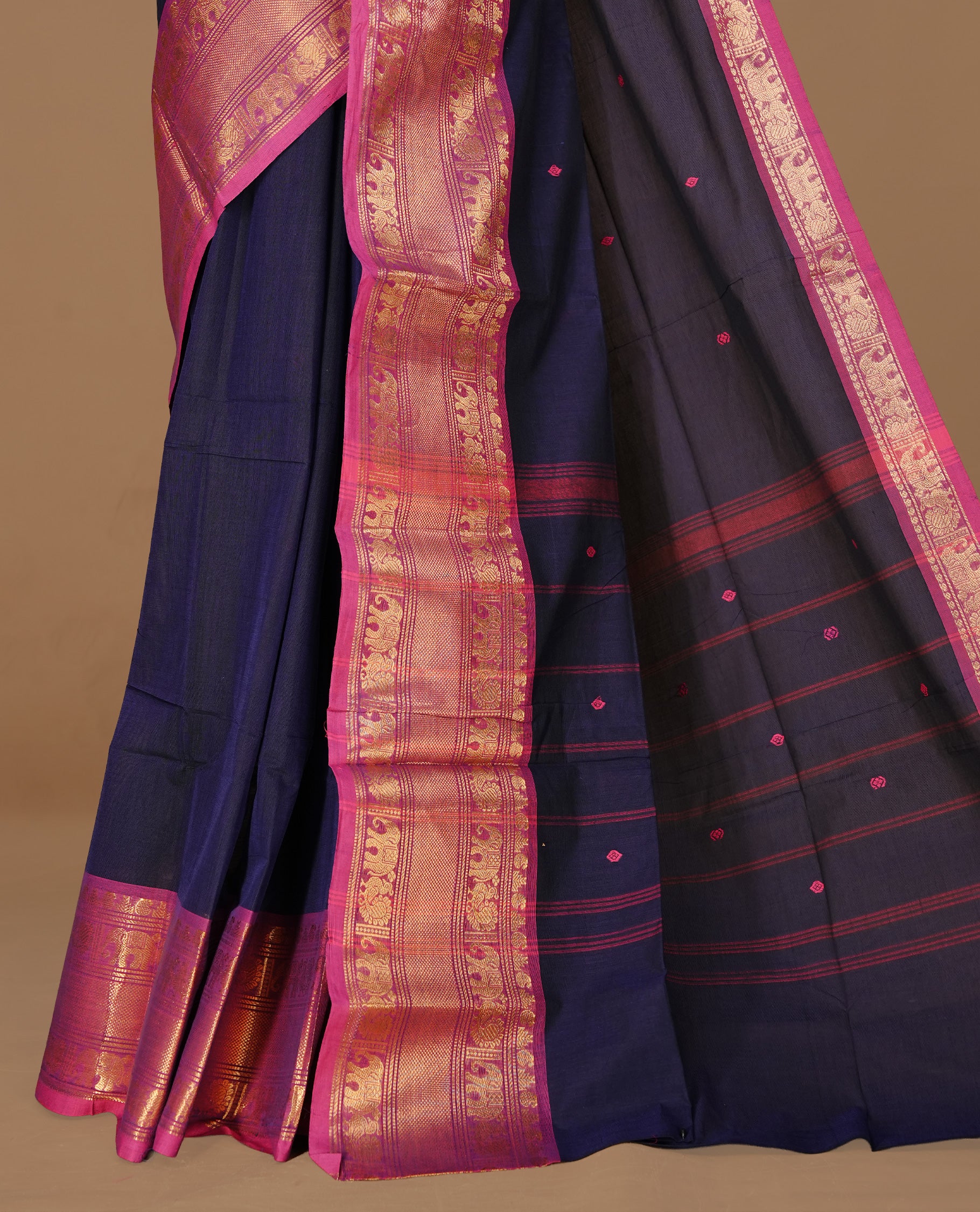 Navy Blue colour Chettinad cotton saree featuring motifs on body , complemented by contrast Magenta colour with zari border, comes with matching blouse piece.
