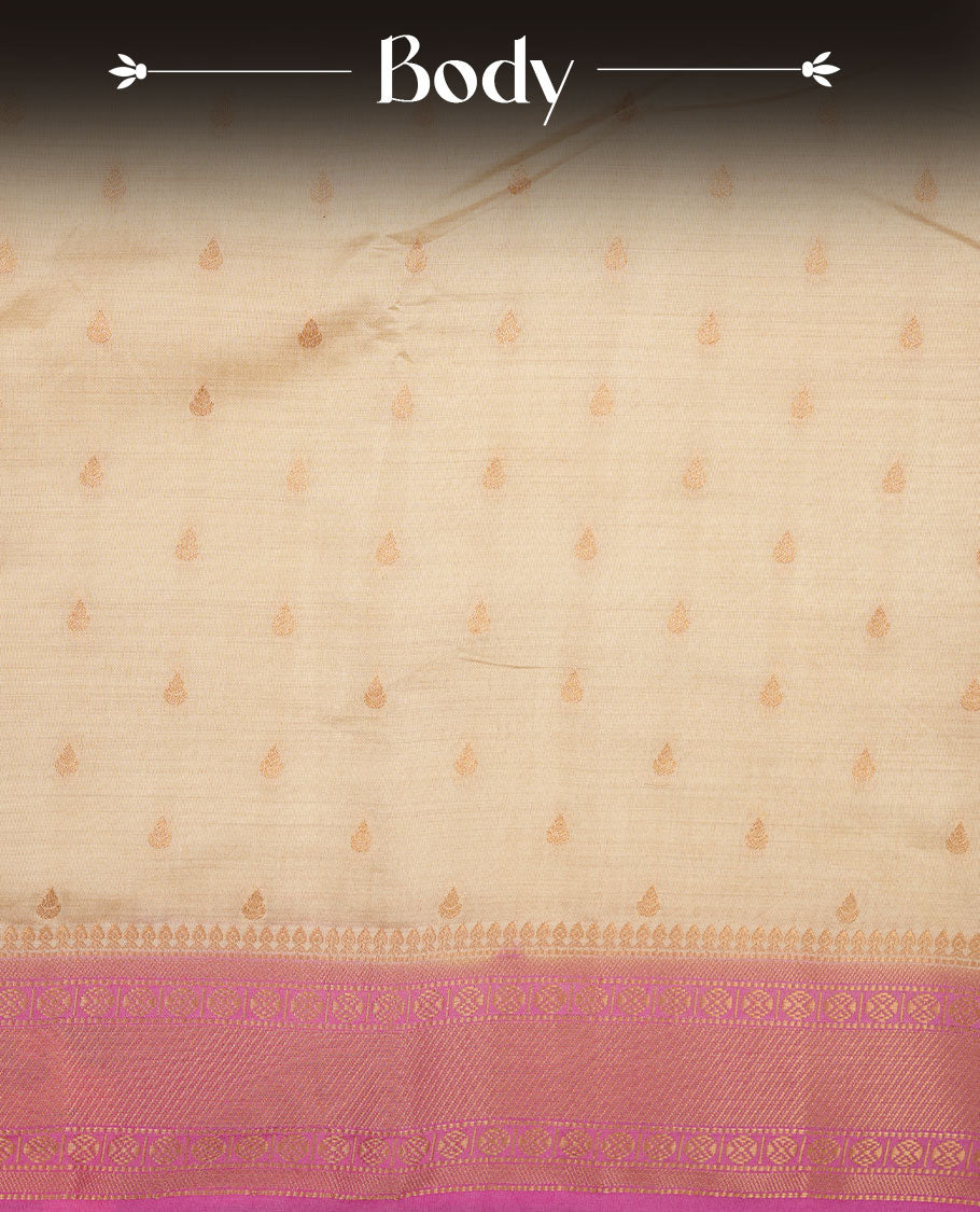 White gold colour semi tussar saree featuring Gold zari buttas body, contrast Pink colour gold zari border and comes with matching blouse piece.