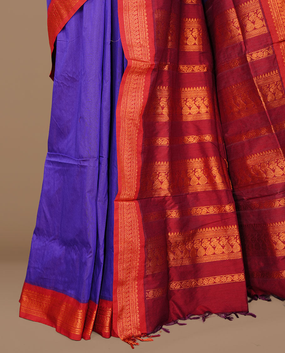 Indigo colour kalyani cotton saree featuring antique zari motifs on body, complemented by Maroon colour with Antique zari border, paired with matching blouse piece.