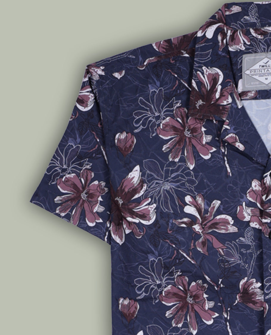 Dark grey colour shirt adorned with brown and white floral prints, featuring short sleeves and a classic collar, A stylish blend of elegance and comfort, perfect for casual and semi-formal wear.