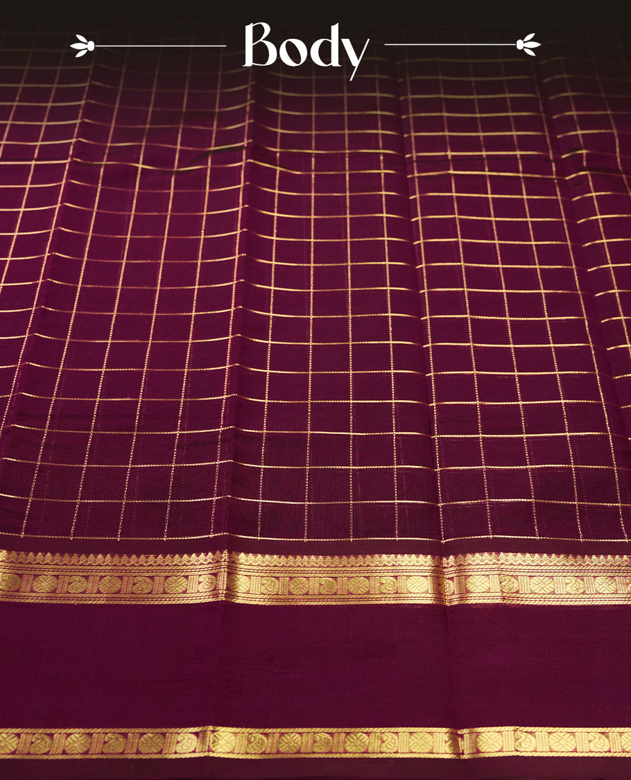Deep Magenta colour pure Kanchi cotton saree featuring with delicate golden checks on body, paired with a contrasting deep maroon zari woven border & Includes a matching blouse piece for a complete look.