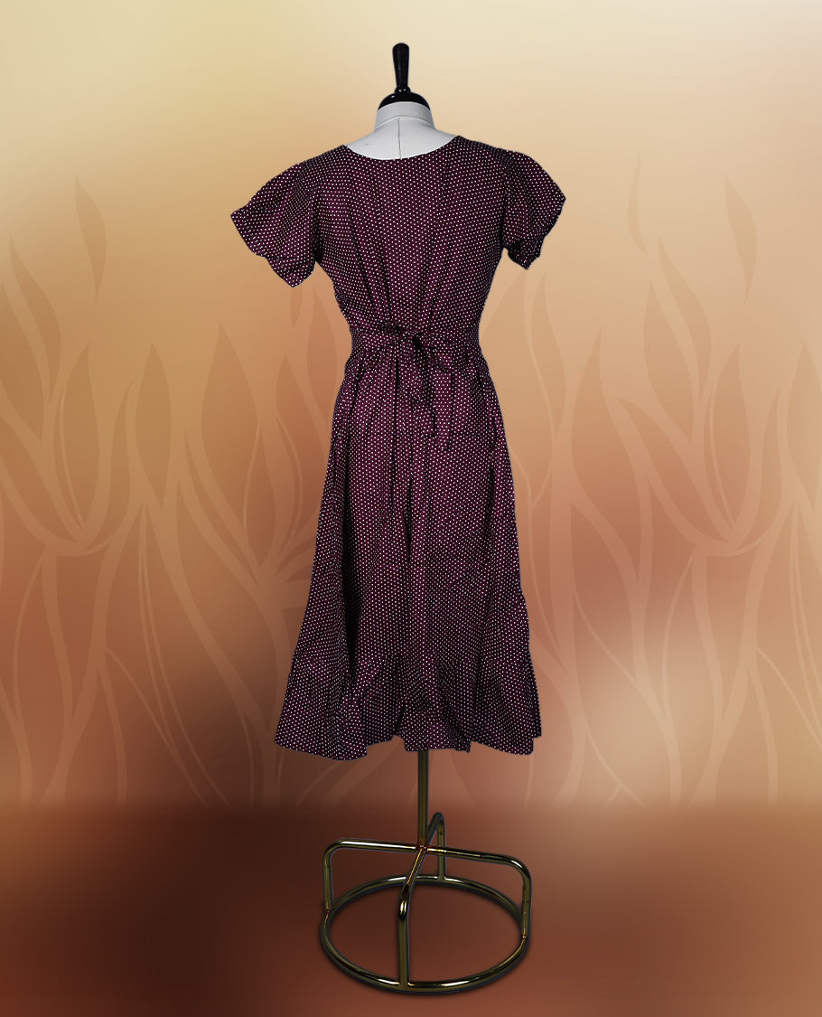 Brown colour nightwear with tiny off white colour polka dots, V neckline, and flutter sleeves & The flared hem with pleats adds a chic touch, Ideal for casual wear, office looks, or relaxed outings with a stylish twist.
