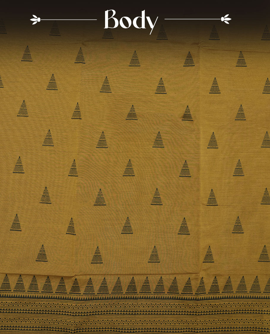 Dark mustard colour poly cotton saree with black temple motifs on the body, paired with a matching pallu with black woven traditional border, and a coordinated all‑over geometric printed blouse piece.