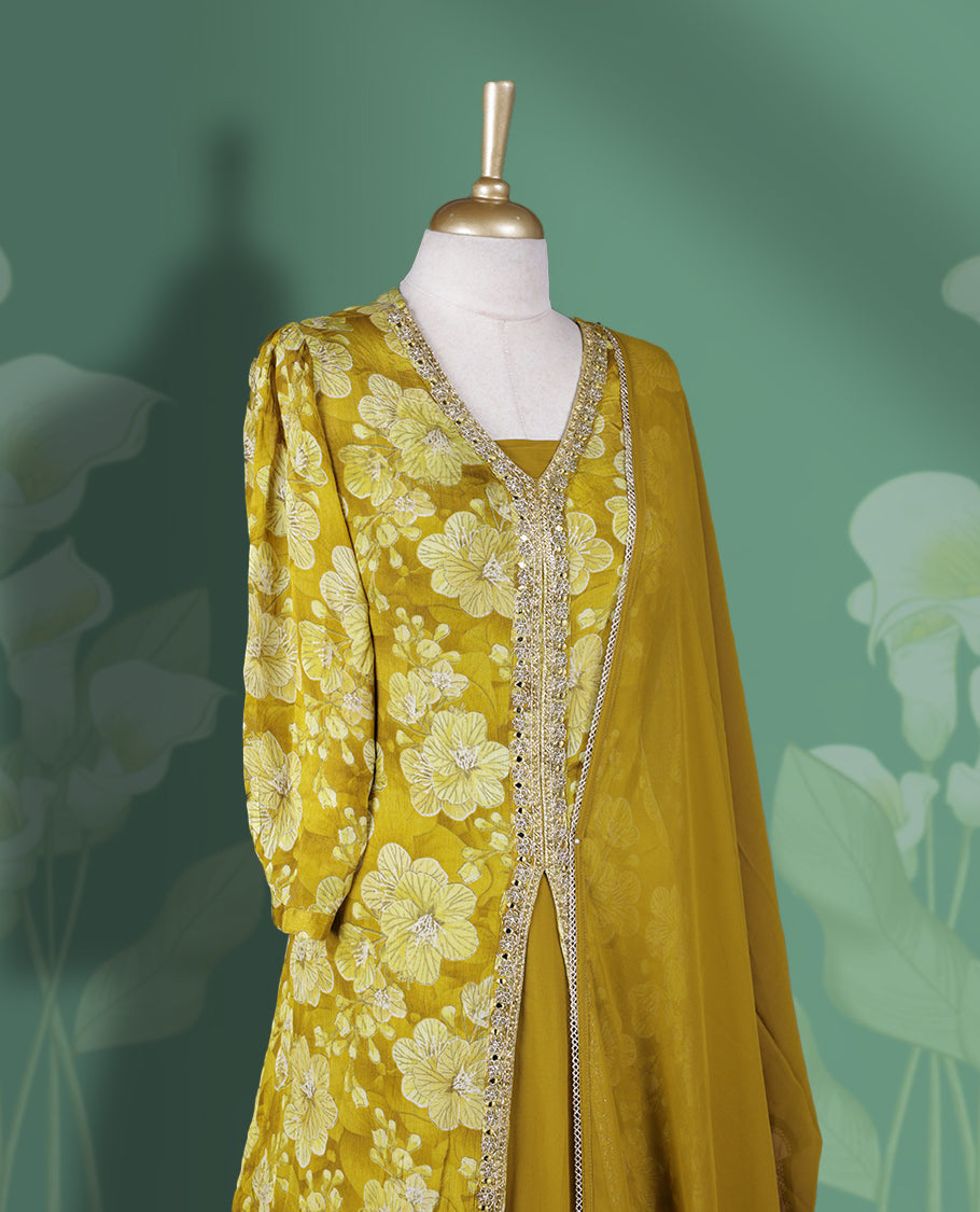 Mustard yellow Anarkali Suit with floral threadwork and sequin detailing on the front, Paired with a plain matching dupatta and gathered flared bottom & A perfect blend of elegance and festive flair.