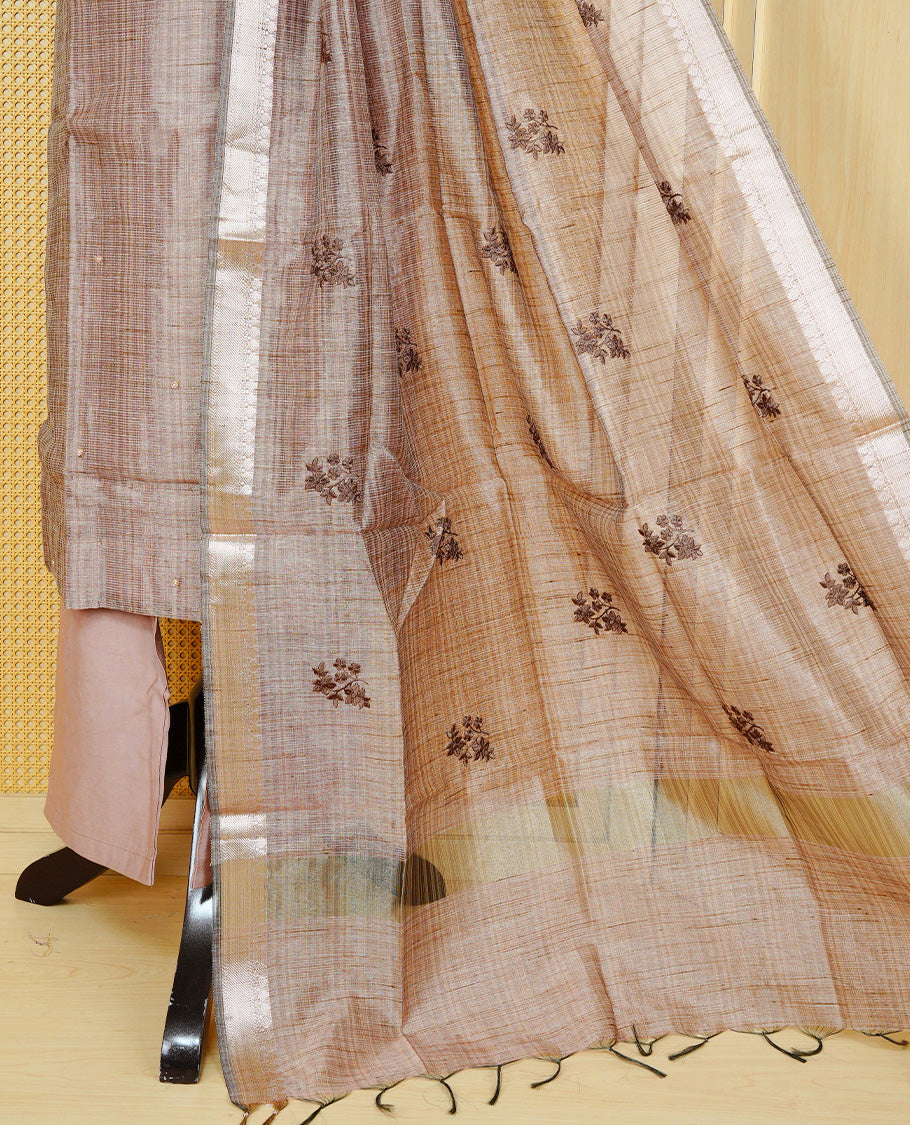 Brown colour Tissue Churidar Set featuring delicate floral embroidery and subtle bead detailing on the yoke, paired with matching solid pants and dupatta.