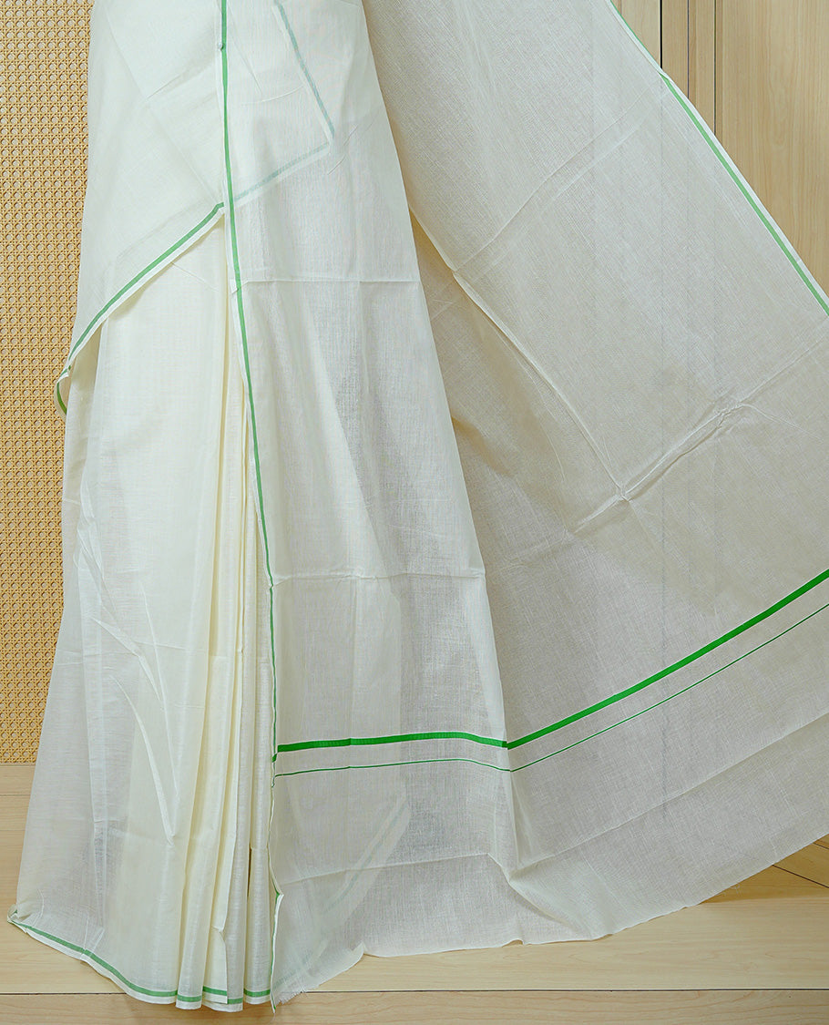 Cream Colour Cotton Kerala Saree Featuring A Classy Plain Body For Effortless Elegance, Enhanced By A Minimalist Light Green Border, Paired With A Matching Blouse Piece