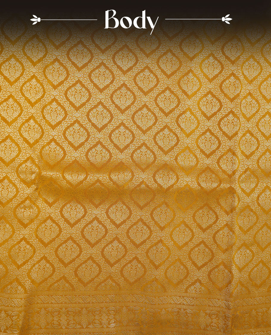 Yellow colour banaras satin crepe saree featuring gold zari pattern across body, with self colour border with gold zari pattern and paired with matching blouse.