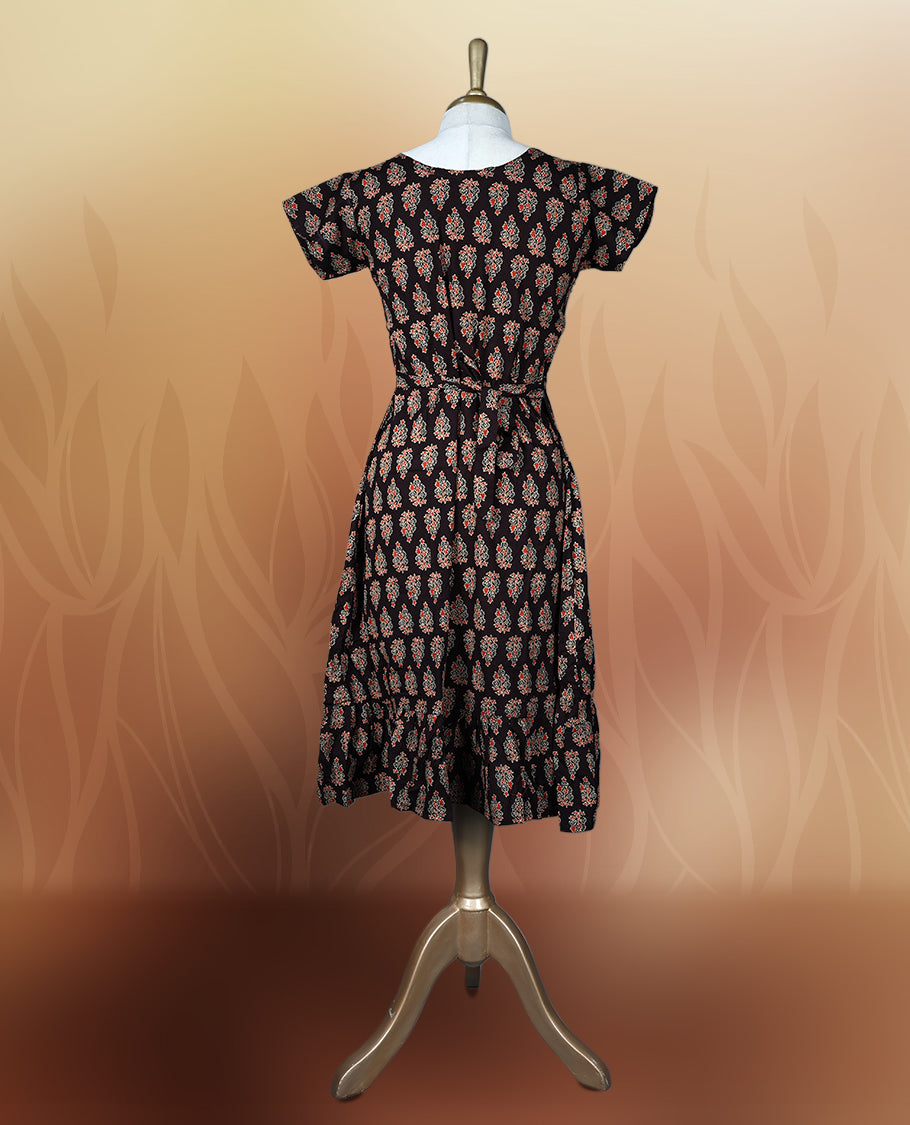 Brownish black colour nightwear with traditional block print motifs in red and beige, Features a V neck, short sleeves, and a stylish tiered flared hem, Perfect for festive events, casual wear, or cultural gatherings.