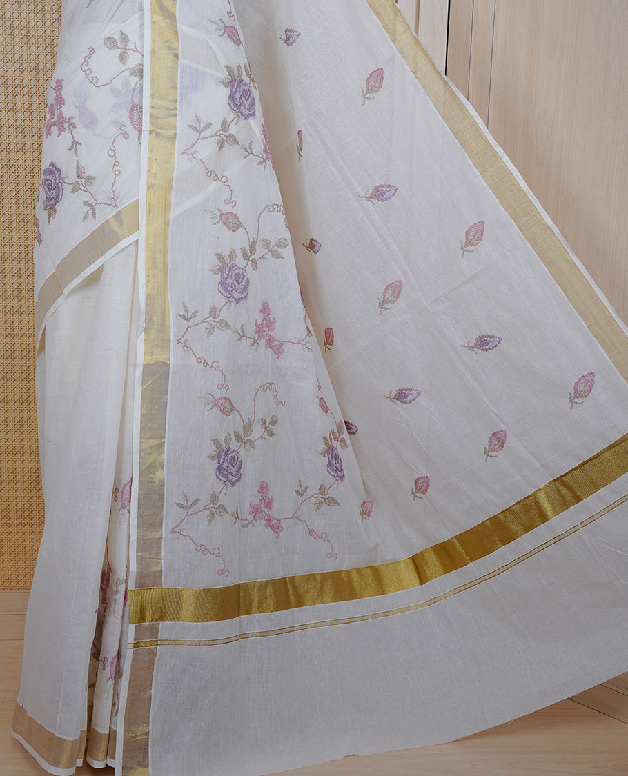 Cream colour Cotton Kerala saree featuring Floral Thread Embroidery work on body, complemented by gold kasavu Border, comes with matching blouse piece.