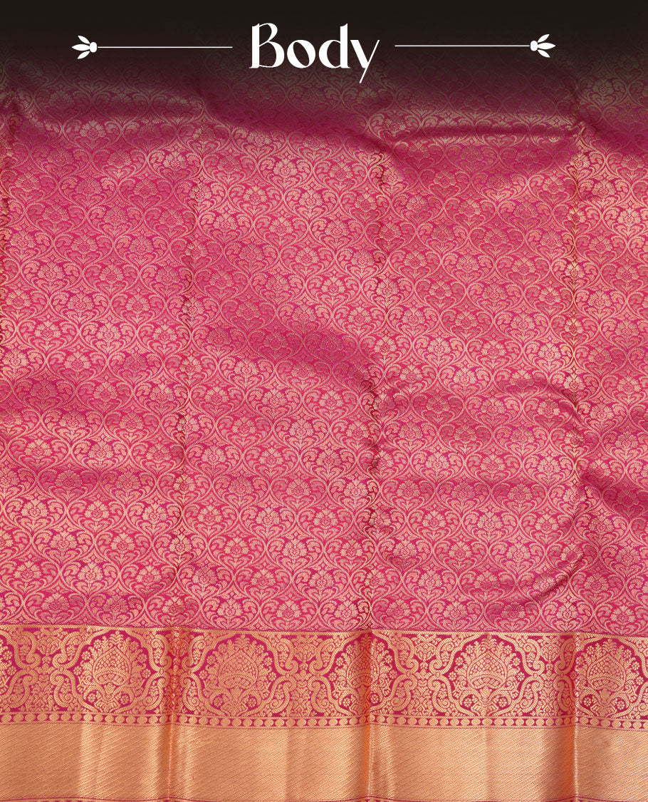 Magenta pink colour kancheepuram silk saree featuring floral zari jacquard on body with traditional border, paired with matching blouse piece.