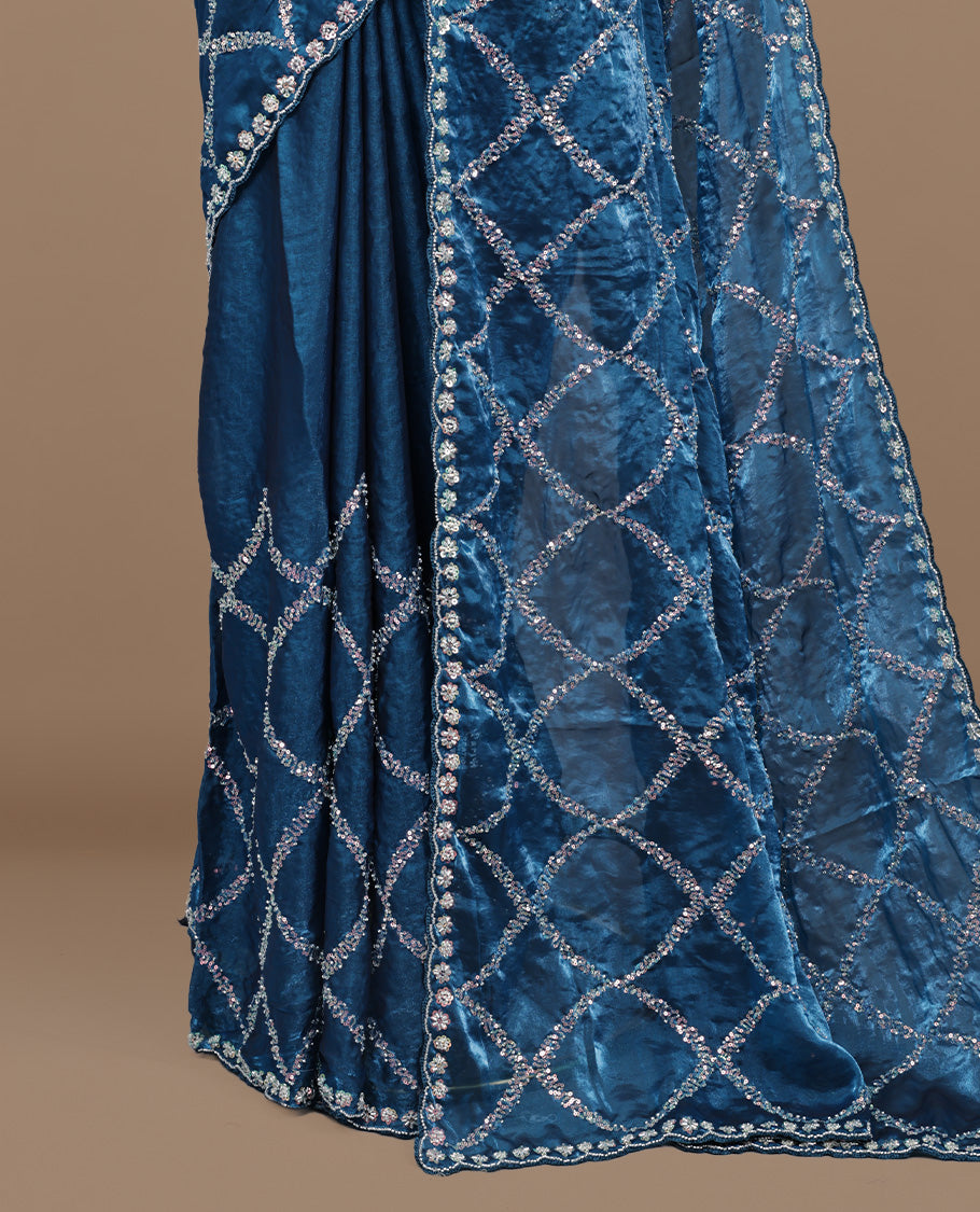 Blue colour designer saree featuring Sequins & cut beats worked body, cut beat worked border, paired with matching unstitched blouse.