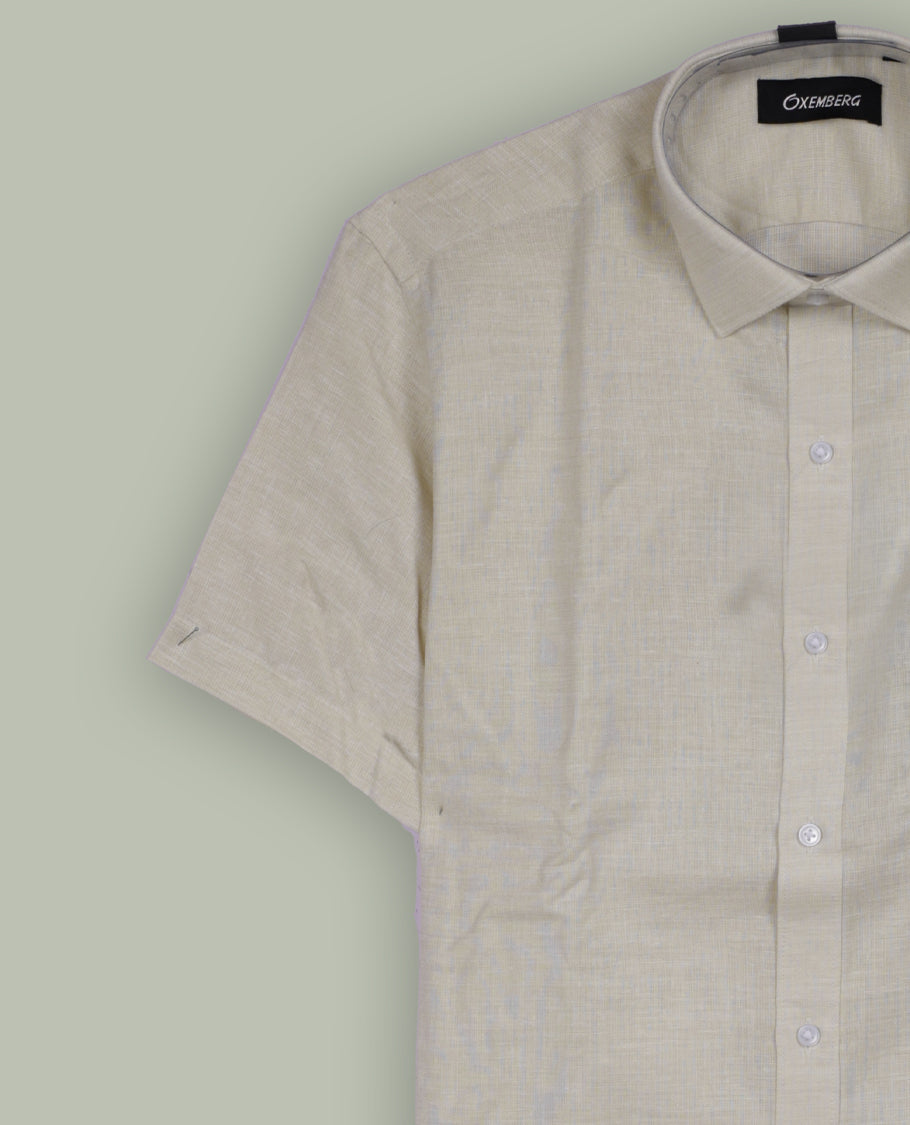 Light beige colour Oxemberg short sleeve shirt with a classic spread collar, Crafted from soft, breathable fabric, it ensures all day comfort and a smart, casual look.