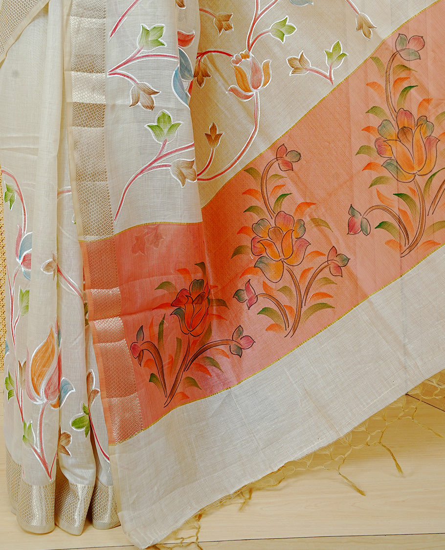 Cream Colour Tissue Kerala Saree Featuring Floral Kodi Threadwork Across The Body, Enhanced With A Light Gold Zari Border And A Peach Floral Pallu, Finished With Gold Tassels And A Matching Blouse Piece