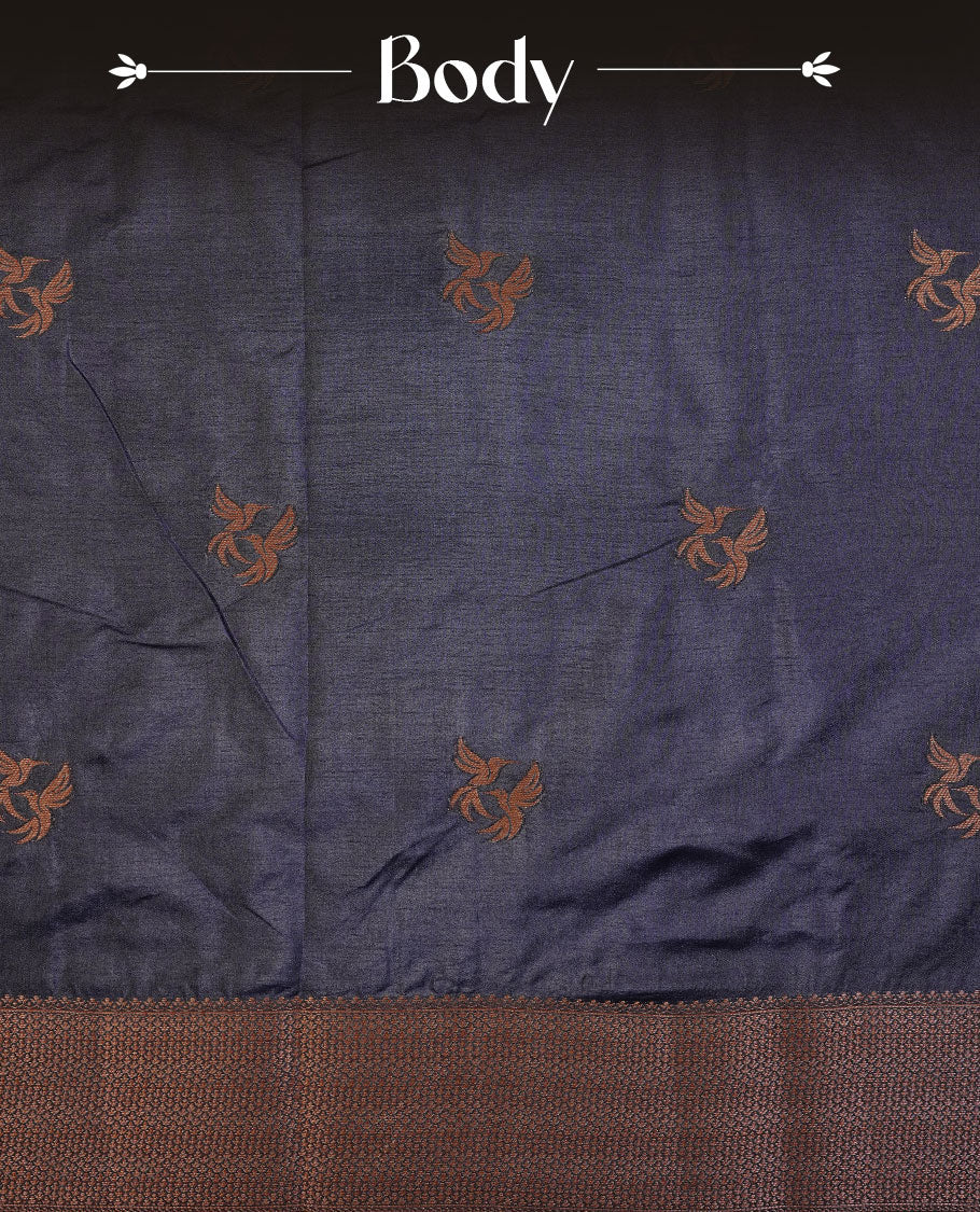 Navy blue colour semi banaras tussar silk saree highlighting gold zari bird motifs on body, complemented by self colour with antique zari border, paired with matching blouse piece.