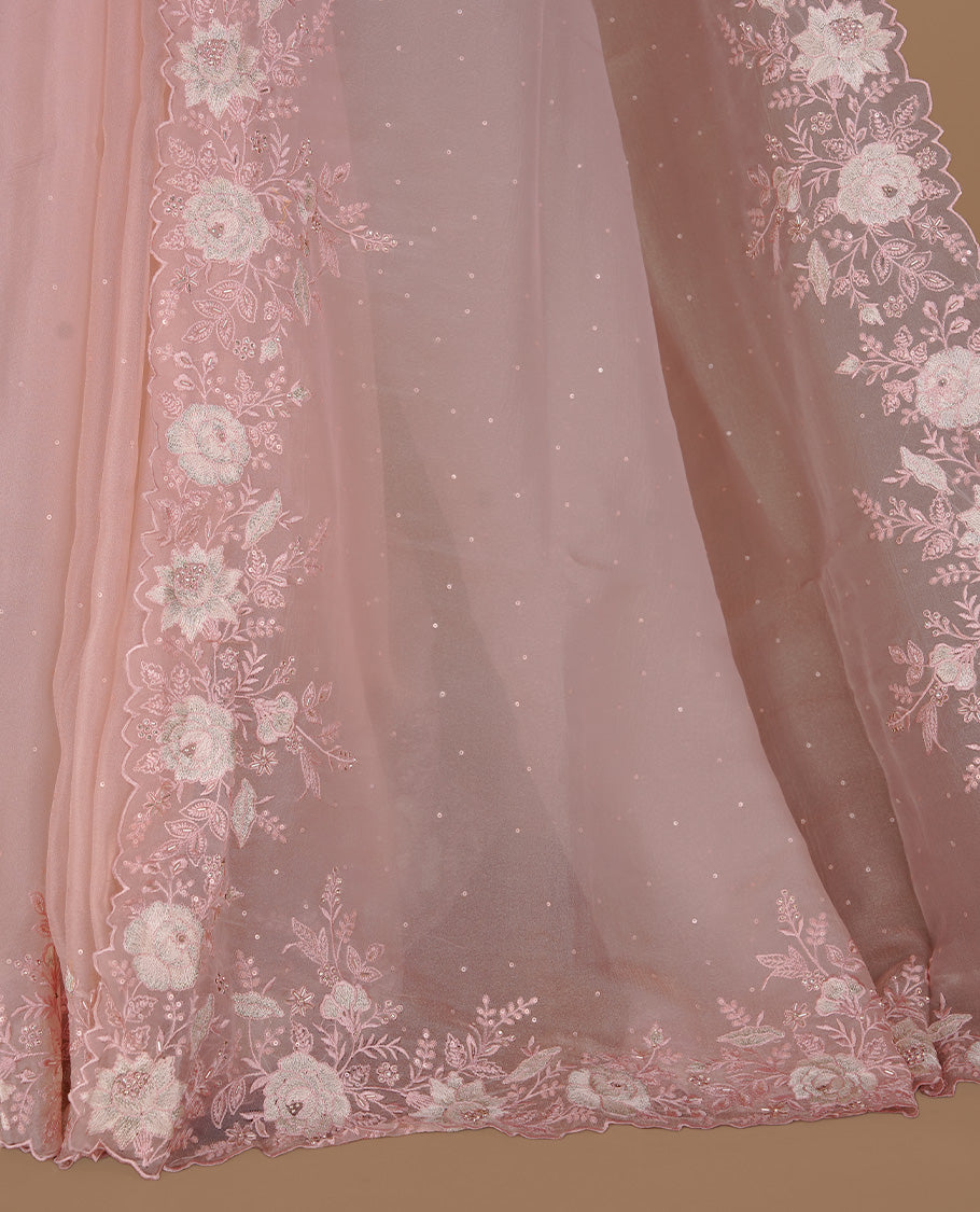 Pastel pink colour organza saree featuring thread with cut beats & sequins floral pattern on body, highlighting scalp border, paired with matching blouse piece.