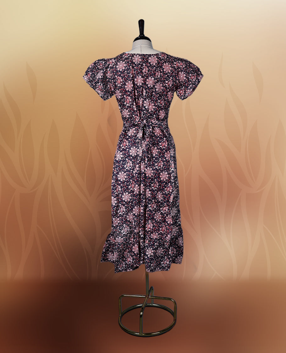 Black colour printed nightwear with soft floral patterns, V neckline, and puff sleeves, The flared hem adds a graceful touch, making it ideal for daily wear, casual outings, or comfy lounge days.