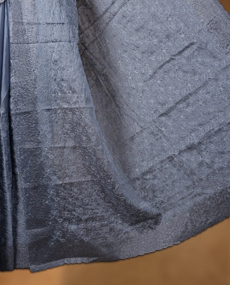 Ash blue colour velvet chiffon designer saree, featuring self colour thread embroidery kodi work on body, stone work and all over motifs on border and pallu, Paired with matching blouse.