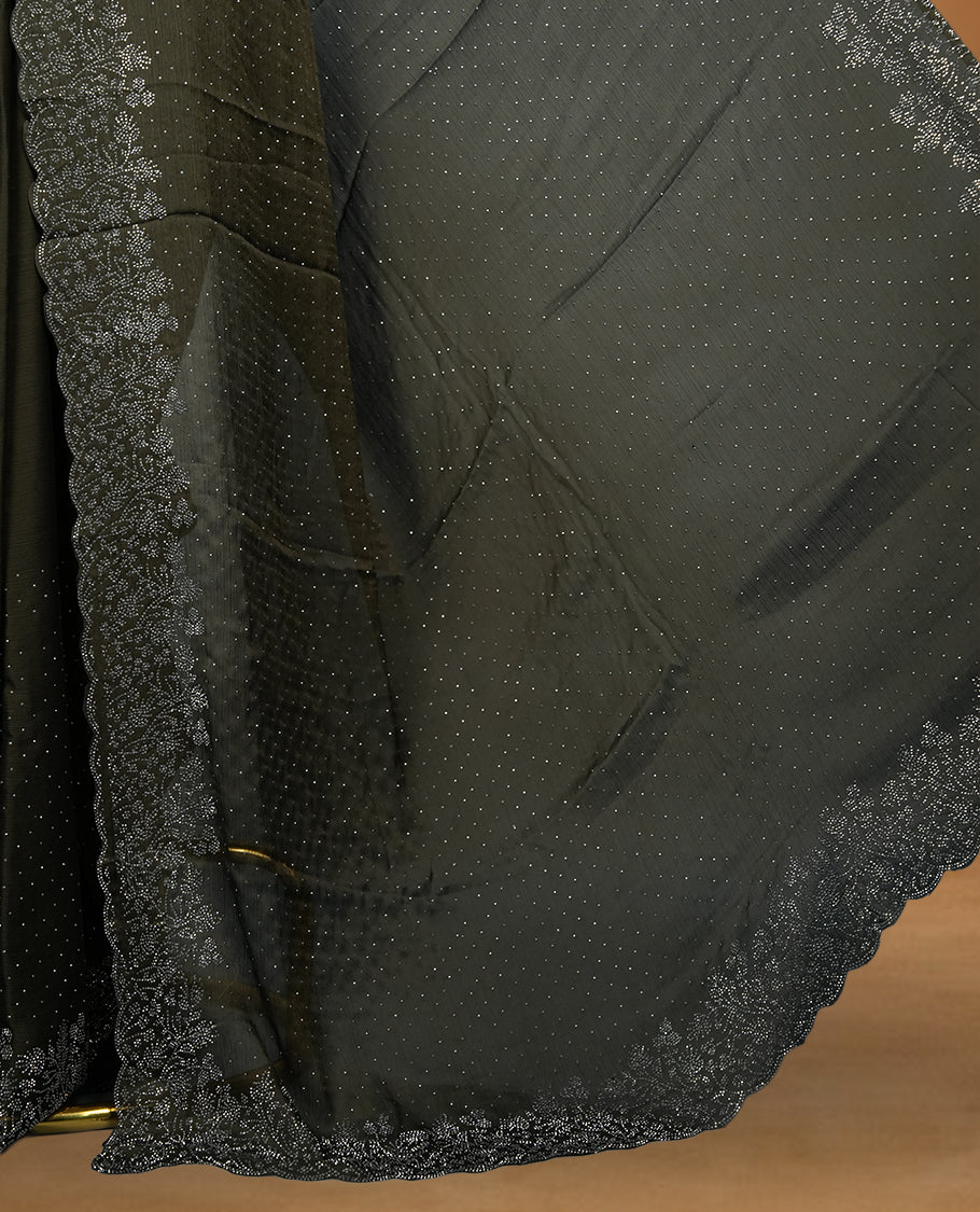 Dark Olive Green Colour Chiffon Designer Saree featuring Delicate White Stone Work All Over the Body, with Stone Detailing on the Border and Pallu, paired with a Matching Blouse.