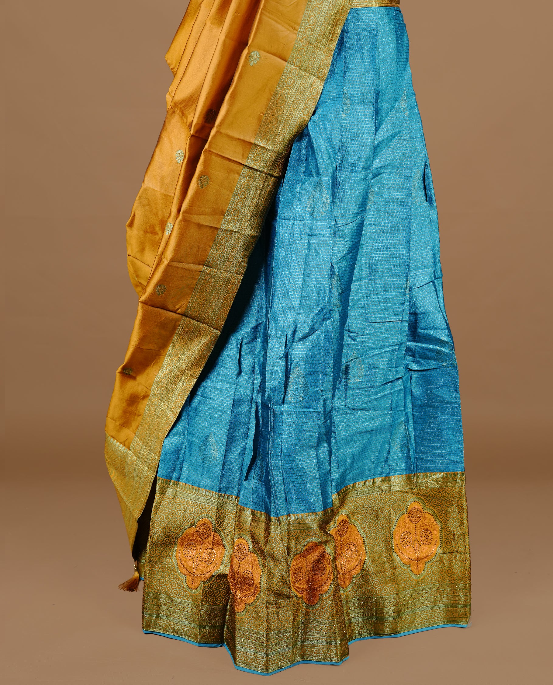Blue colour Half saree featuring a blue colour skirt with contrast mustrad colour border with zari pattern,stone work, paired with matching dupatta, stitched blouse.