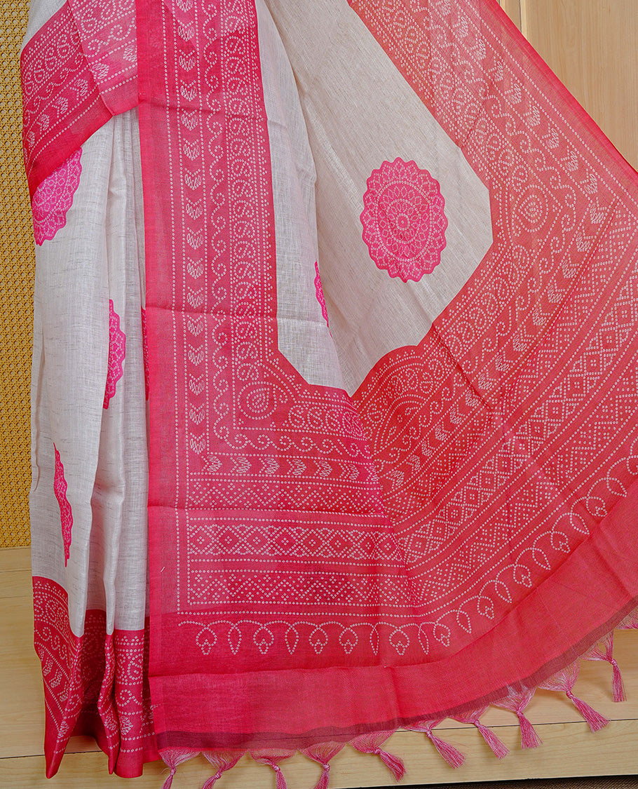 Cream colour semi linen saree featuring Pink Ajrakh pattern print on body, complemented by contrast Red colour with same pattern print border, comes with matching blouse piece.