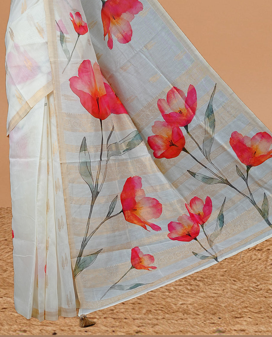 Cream Colour Organza Kerala Saree Featuring Red Floral Print On The Body, Tassels On The Pallu With A Matching Blouse Piece.